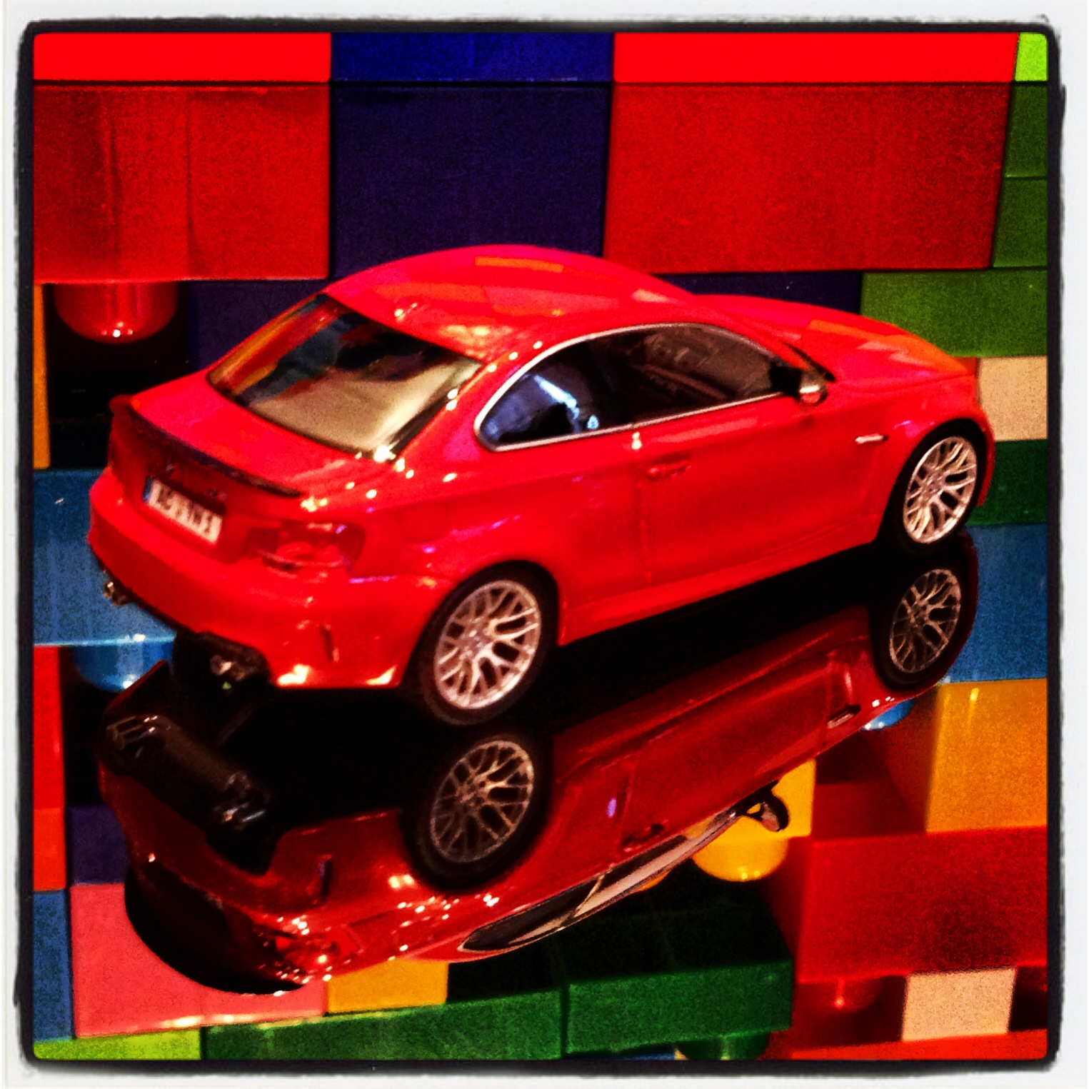 BMW 1M coupe (E82) red with black spoiler (minichamps)