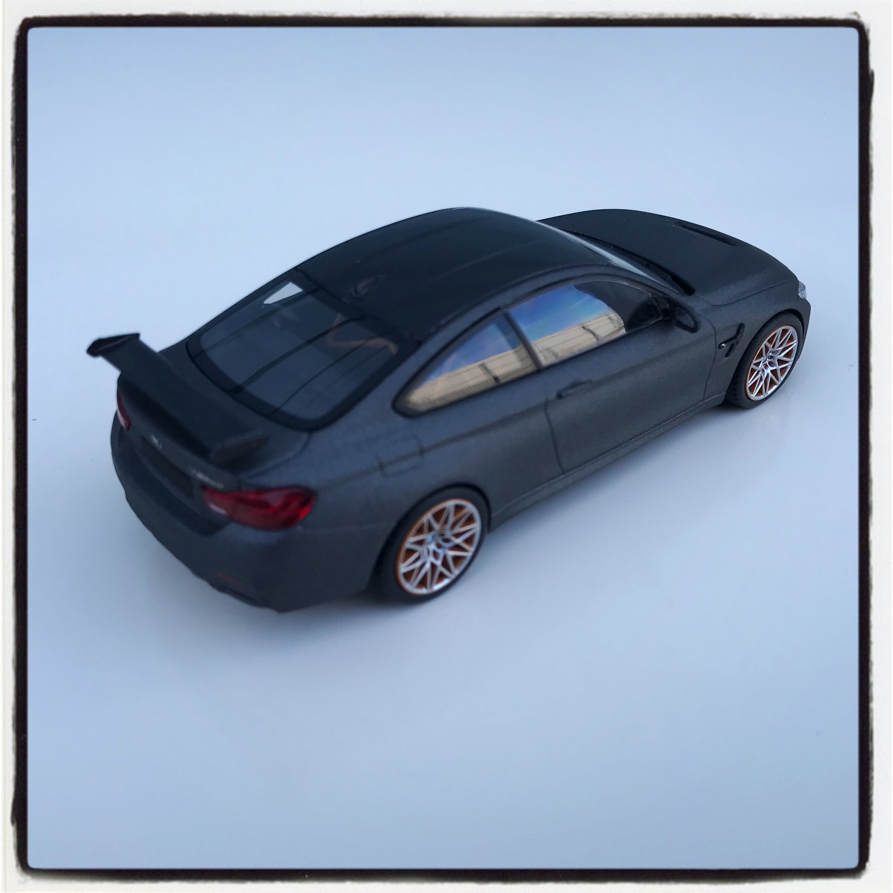 BMW M4 GTS (F82) frozen dark grey with orange wheels, le 1 of 1,008 pcs. (minichamps)